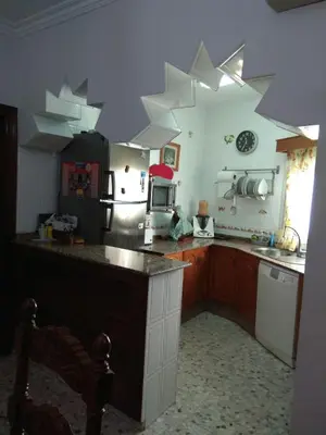a kitchen with white stars on the ceiling at Downtown house centro histórico in Arcos de la Frontera