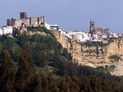 a castle perched on top of a mountain at Apartamento centro histórico Arcos in Arcos de la Frontera