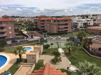 an aerial view of a city with buildings and a parking lot at Apartamento Julieta in Sanlúcar de Barrameda