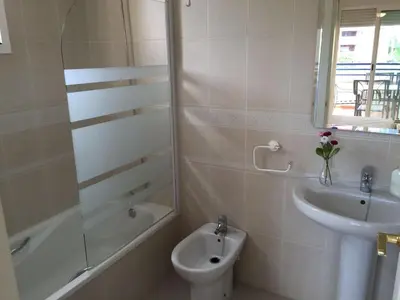 a bathroom with a sink and a toilet and a shower at Apartamento Julieta in Sanlúcar de Barrameda
