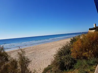 a view of a beach with people in the water at Novo Paradise in Chiclana de la Frontera