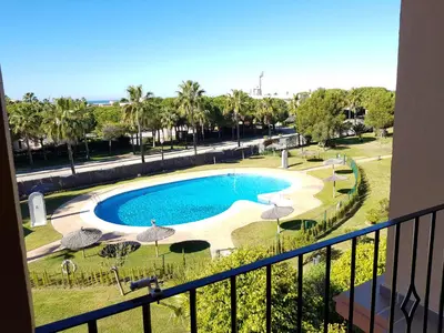 a view of a swimming pool from a balcony at Novo Paradise in Chiclana de la Frontera