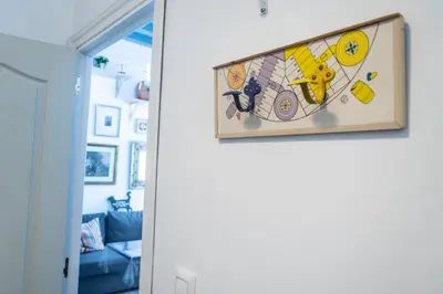 a painting hanging on a wall in a room at El parador de la artesana in Cádiz