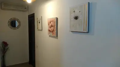 a hallway with three pictures on the wall at Alojamiento rural 