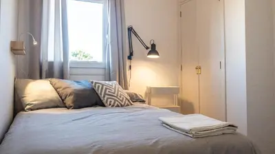 a bed in a room with a window at Apartamento Cadiz Paradiso in Cádiz
