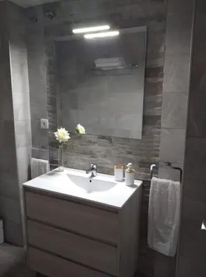 a bathroom with a sink and a mirror at Apartamento La Gaviota in Chipiona