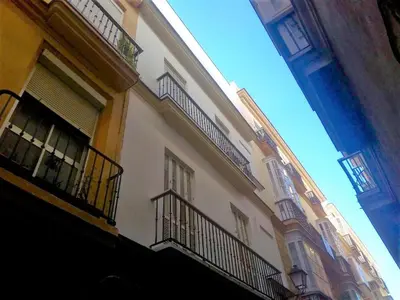 a building with balconies on the side of it at Apartamento Feduchy in Cádiz