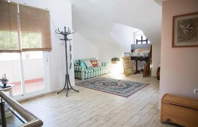 a living room with a couch and a table at Casa/Chalet Doñana in Sanlúcar de Barrameda