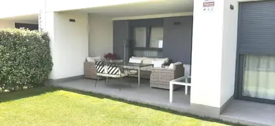 a patio with a table and chairs on a house at Vivienda Vistahermosa Playa in El Puerto de Santa María