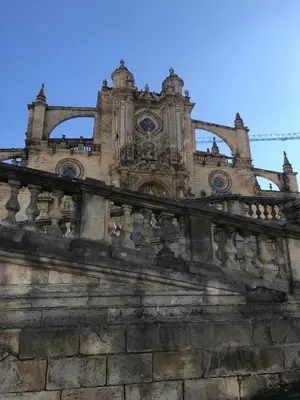 an old stone building with a blue sky in the background at Apartamento !!VIVE JEREZ!! in Jerez de la Frontera