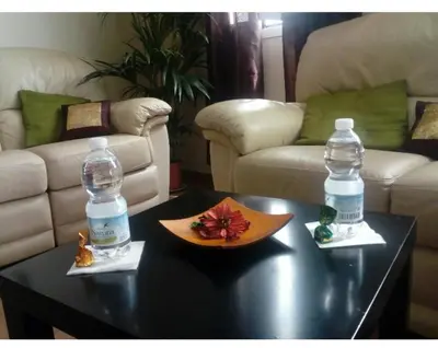 a table with two bottles of water on top of it at Playa caleta 7 min, wifi, catedral, centro in Cádiz