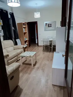 a living room with a couch and a table at Playa caleta 7 min, wifi, catedral, centro in Cádiz