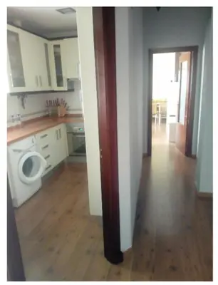 a kitchen with a washer and dryer in a house at Playa caleta 7 min, wifi, catedral, centro in Cádiz