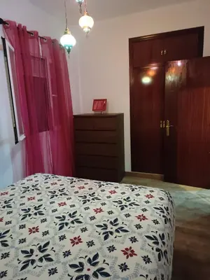 a bedroom with a bed and a dresser at Playa caleta 7 min, wifi, catedral, centro in Cádiz