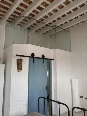 a room with a blue door and a ceiling at LA BENDITA LOCURA in El Puerto de Santa María