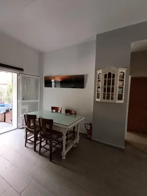 a dining room with a ping pong table and chairs at Apartamento La Domus in Cádiz