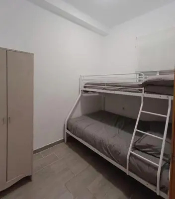 a room with two bunk beds in a room at Apartamento La Domus in Cádiz