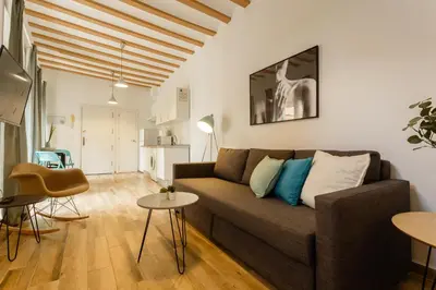 a living room with a couch and a table at Balcones de CANDELARIA by Cadiz4Rentals in Cádiz