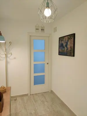 a room with a door and a picture on the wall at SHERRY HOME in Jerez de la Frontera