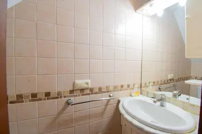 a bathroom with a sink and a mirror at Casa Rural Napoleón in Medina Sidonia