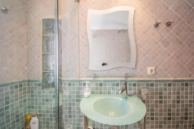 a bathroom with a sink and a mirror at Casa Rural Napoleón in Medina Sidonia