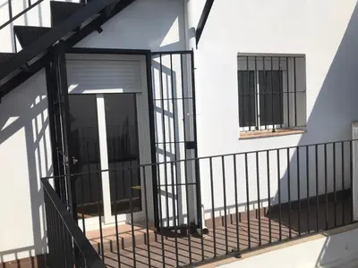 an entrance to a building with a door and windows at Atico Terraza Cadiz Centro Ascensor Playa de la Caleta in Cádiz