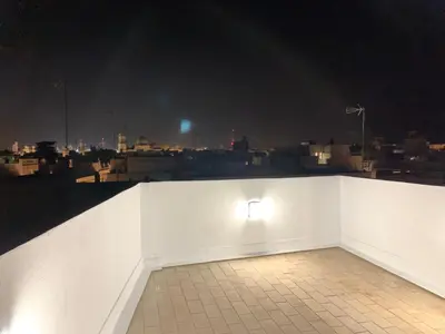 a white wall with a light on it at night at Atico Terraza Cadiz Centro Ascensor Playa de la Caleta in Cádiz