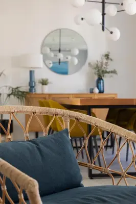 a couch with a blue pillow in a living room at Candelaria10 in Cádiz