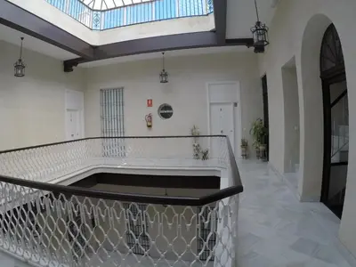 a large room with a large tub in the middle at El Rinconcito - apartamento palacete rehabilitado in El Puerto de Santa María