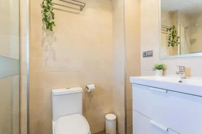a bathroom with a toilet and a sink at San Jose 2 baños in Cádiz
