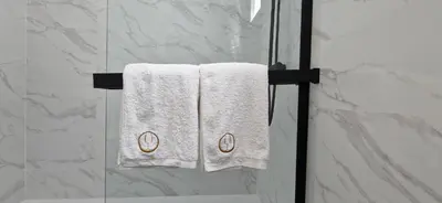 two towels on a towel rack in a bathroom at Apartamentos Arenal in Jerez de la Frontera