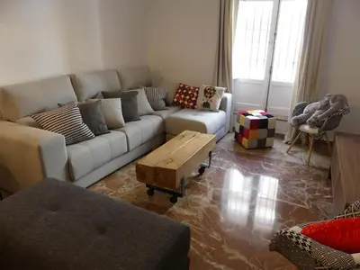 a living room with a couch and a coffee table at GATU PREMIUM Villa Aramburu, 