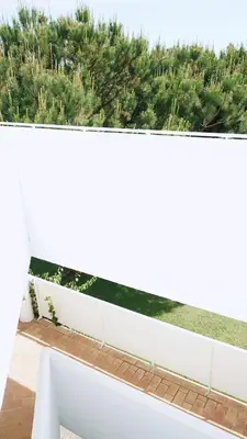 a white fence on a balcony with trees at Retama Golf Nº 55 by Fontanilla Del Mar Holidays Rentals in Chiclana de la Frontera