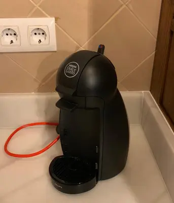 a black coffee maker sitting on top of a counter at Casa Boutique Sanlucar in Sanlúcar de Barrameda