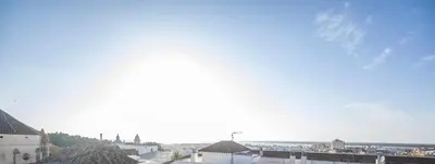 a view of a city with buildings and the sky at Casa Boutique Sanlucar in Sanlúcar de Barrameda