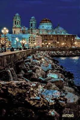 a view of a large building at night at Casa Conchita in Cádiz