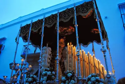 a chandelier with candles in front of a building at Loft Catedral Jerez in Jerez de la Frontera