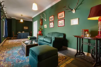 a living room with a couch and a table at Suite Catedral Jerez in Jerez de la Frontera