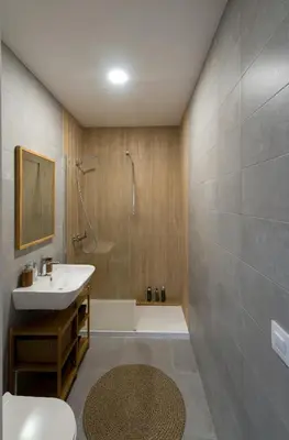 a bathroom with a sink and a shower and a toilet at Bohórquez Rooms by Ático73 in Medina Sidonia