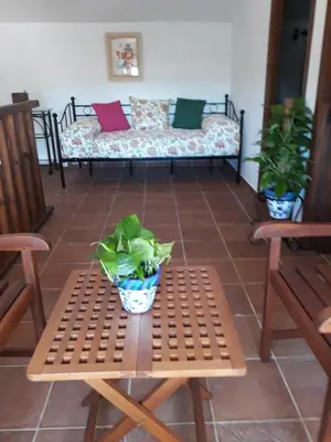 a living room with a couch and a table and chairs at Albara in Conil de la Frontera