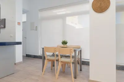 a dining room with a table and two chairs at Panther Home Aladro III in Jerez de la Frontera