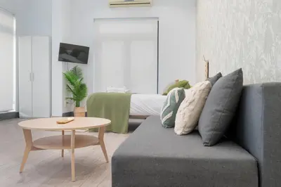 a living room with a couch and a table at Panther Home Aladro III in Jerez de la Frontera