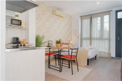 a kitchen and dining room with a table and chairs at Panther Home Aladro V in Jerez de la Frontera