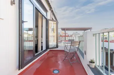 a balcony with a chair and a table at Panther Home Aladro V in Jerez de la Frontera