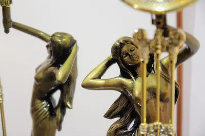 a brass figurine of a woman playing a harp at Apartamento SERAFÍN de la Caleta in Cádiz