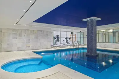 a large swimming pool in a house at Hipotels Sherry Park in Jerez de la Frontera