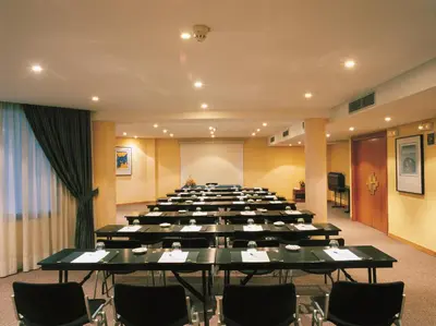 a large room with tables and chairs in it at Hipotels Sherry Park in Jerez de la Frontera