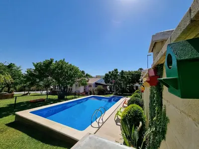 a swimming pool in the yard of a house at Carretera Pinar de los Franceses JAZMIN in Chiclana de la Frontera