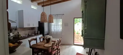 a kitchen with a table and a dining room at Carretera Pinar de los Franceses JAZMIN in Chiclana de la Frontera