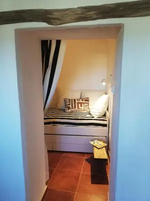 a small bedroom with a bed in a room at Casa MariSol in Arcos de la Frontera